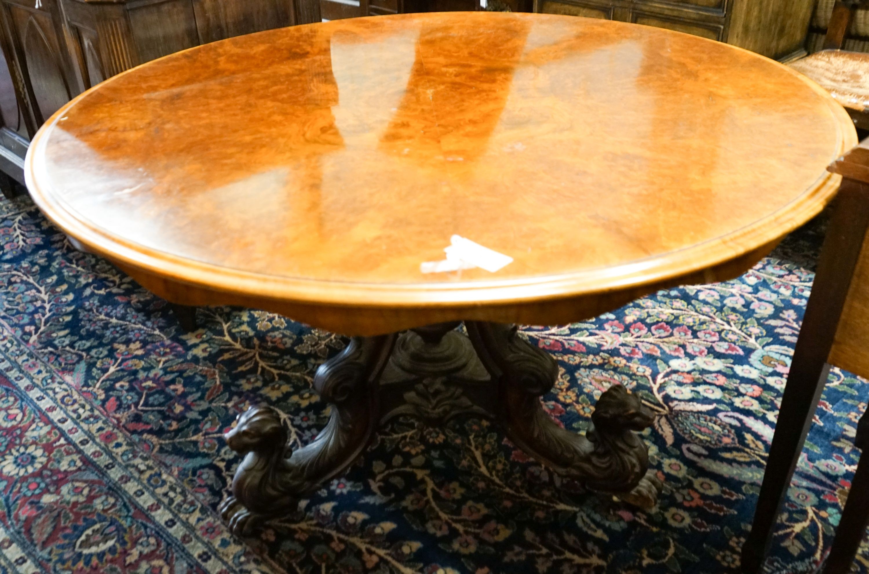 A mid-Victorian burr walnut-veneered circular tilt-top breakfast table, diameter 130cm, height 73cm